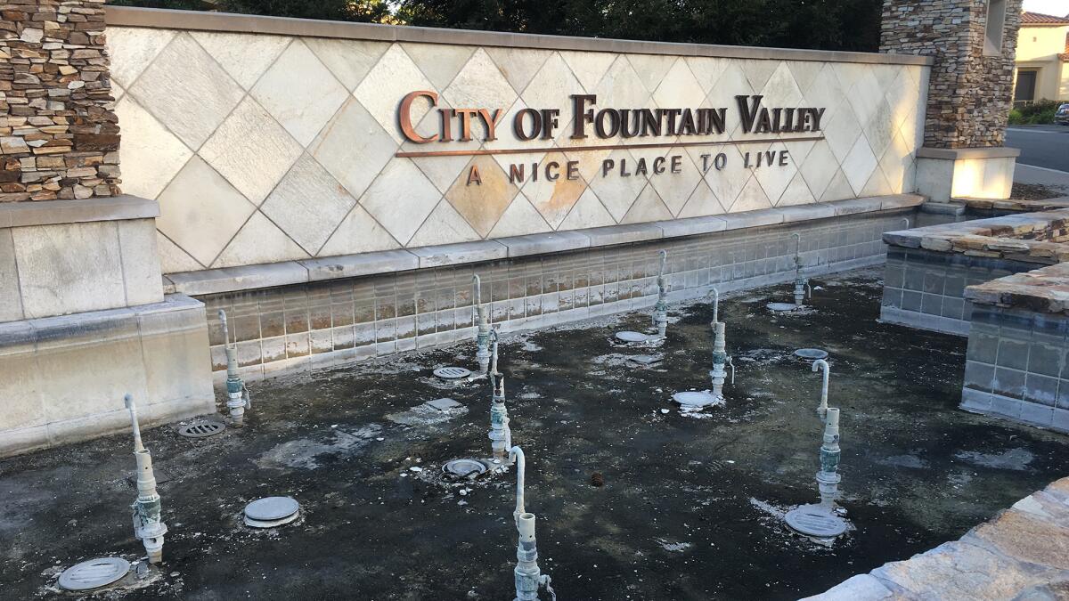 A large fountain in Fountain Valley remains dry.