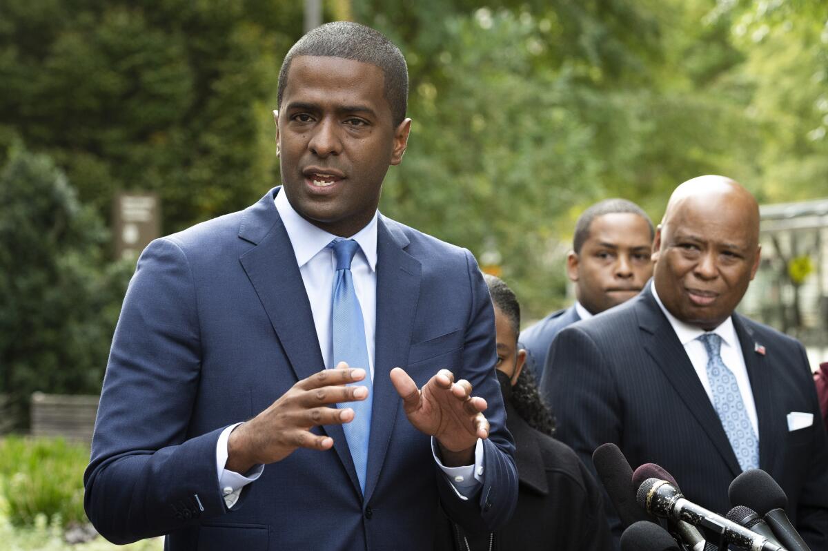FILE - Bakari Sellers, the attorney for the families of victims killed in the 2015 Mother Emanuel AME Church massacre, speaks with reporters outside the Justice Department, in Washington, Thursday, Oct. 28, 2021. A lawsuit alleging the rampant sexual abuse of underage athletes at a competitive cheerleading gym in South Carolina has been amended to name six more coaches as defendants and three more accusers. One of the plaintiffs' lawyers, Bakari Sellers, likened the case to that of Larry Nassar, the former USA Gymnastics and Michigan State University doctor. (AP Photo/Cliff Owen, File)