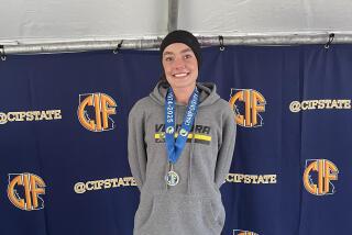 A smiling Sadie Engelhardt of Ventura after winning the Division 2 state cross-country title.