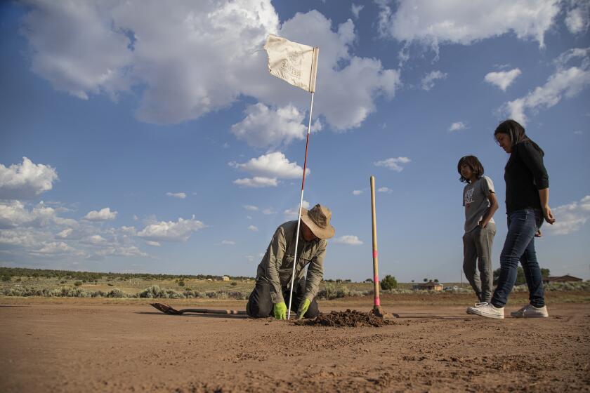 STEAMBOAT, AZ - JULY 19, 2019: Navajo Indian Donald Benally digs a hole manually on the putting surface for the 6th hole on his Rez Golf Course on the Navajo Reservation July 19, 2019 in Steamboat, Arizona. (Gina Ferazzi/Los AngelesTimes)
