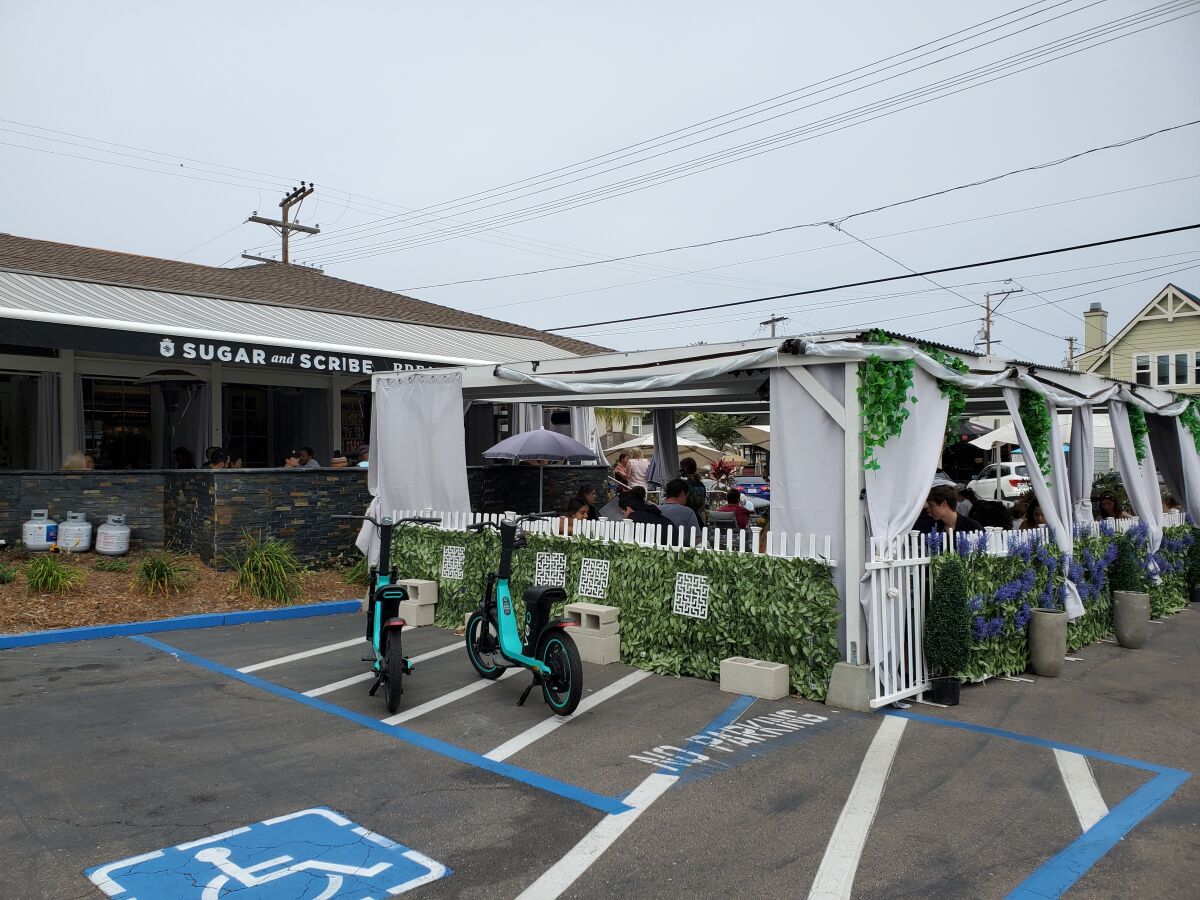 Sugar and Scribe restaurant on Fay Avenue extended its outdoor dining onto its parking lot.