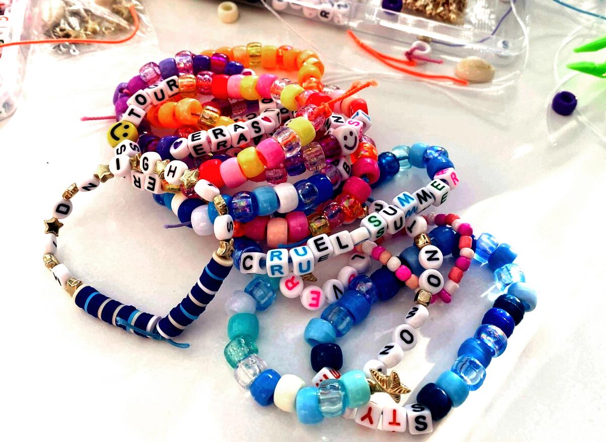 A pile of homemade friendship bracelets on a table