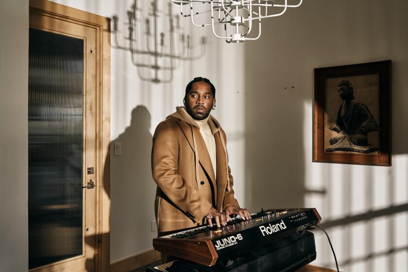 LOS ANGELES, CALIFORNIA - February 12, 2022: Darius Scott, musically known as DIXSON, a singer, songwriter and producer, poses for a portrait at the Vintage Synthesizer Museum in the Highland Park neighborhood of Los Angeles, CA. His song with Beyonce, "Be Alive," for the film "King Richard," has been nominated for an Oscar. CREDIT: Philip Cheung / For The Times