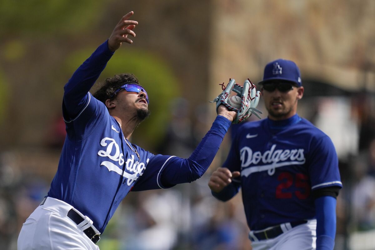 Miguel Vargas catches a pop fly during a spring game against the San Diego Padres.