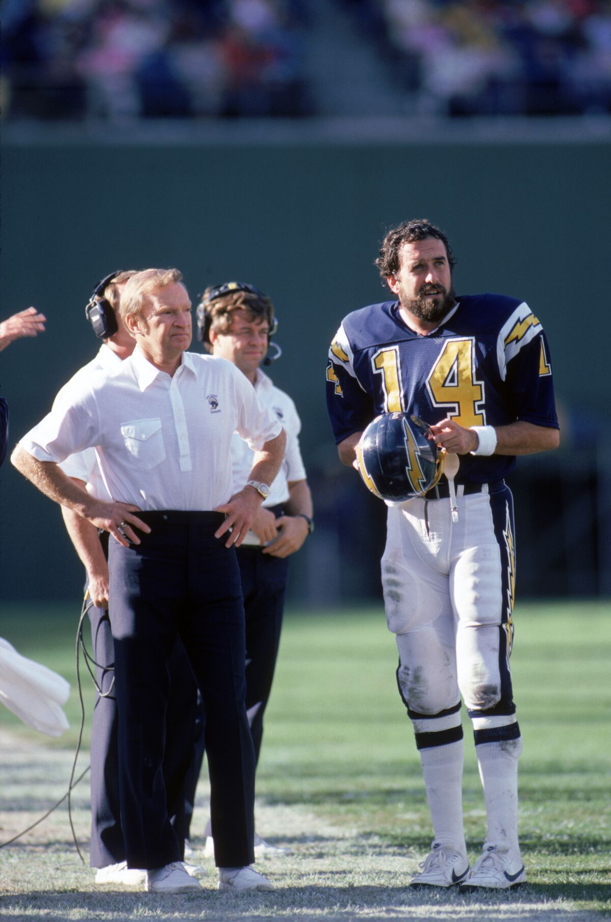 Head coach Don Coryell and quarterback Dan Fouts of the San Diego Chargers discuss strategy during game in December 1985.