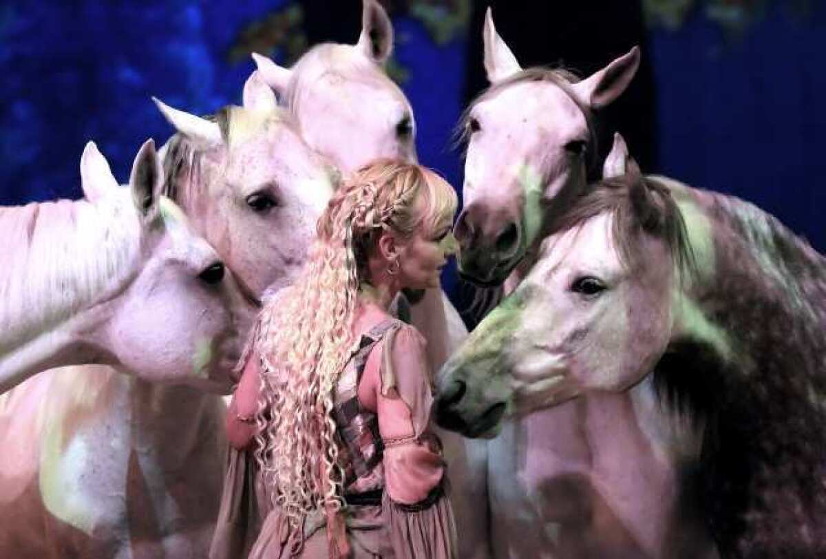Sylvia Zerbini talks to her horses during the "Liberte" segment of the Cavalia Show in Burbank on Jan. 18.