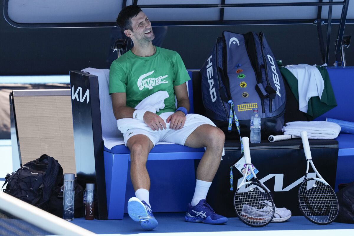 Defending men's champion Serbia's Novak Djokovic smiles during a break in his practice on Margaret Court Arena ahead of the Australian Open tennis championship in Melbourne, Australia, Thursday, Jan. 13, 2022. AP Photo/Mark Baker)