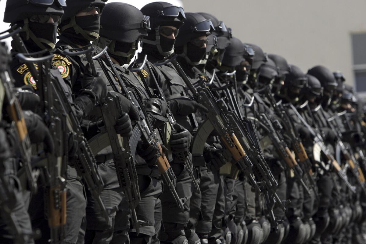 Palestinian security forces line up in the West Bank city of Jenin, where they were deployed Wednesday to help restore order.