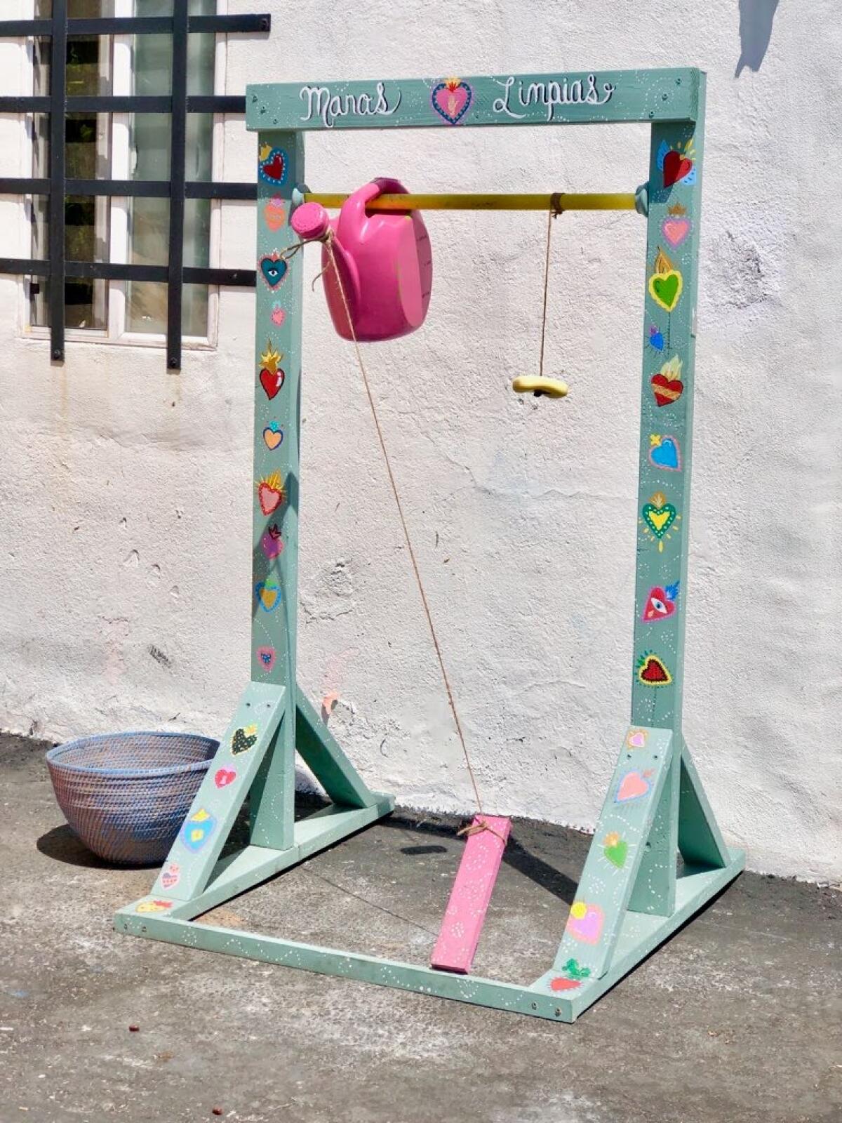 One of Alexandra Perez Demma's hand washing stations placed along Logan Avenue during Walk The Block
