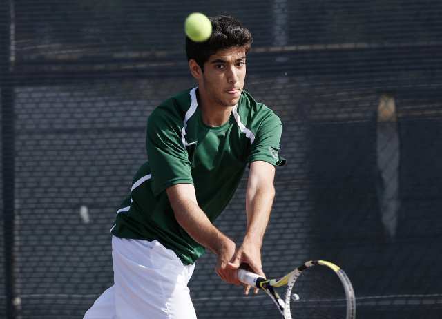 Sage Hill's Nasier Emtiaz returns a ball against Cerritos' Ganesh Alagappan during the CIF Southern Section Division III semifinals at Cerritos High.