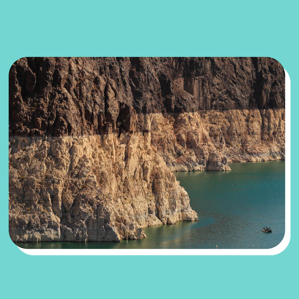 A boater gets an up-close view of the "bathtub ring" on Lake Mead. 