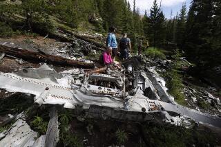 Relatives of members of the 1970 Wichita State University Shockers football team visit the crash site where an airplane carrying some of the players crashed near Loveland Pass Monday, July 27, 2020, west of Silver Plume, Colo. Wreckage from the plane, which was one of two being used to take the Shockers to play a football game against Utah State University in Logan, Utah, is still scattered on the mountain top nearly 50 years after the crash close to the Eisenhower Tunnel. (AP Photo/David Zalubowski)