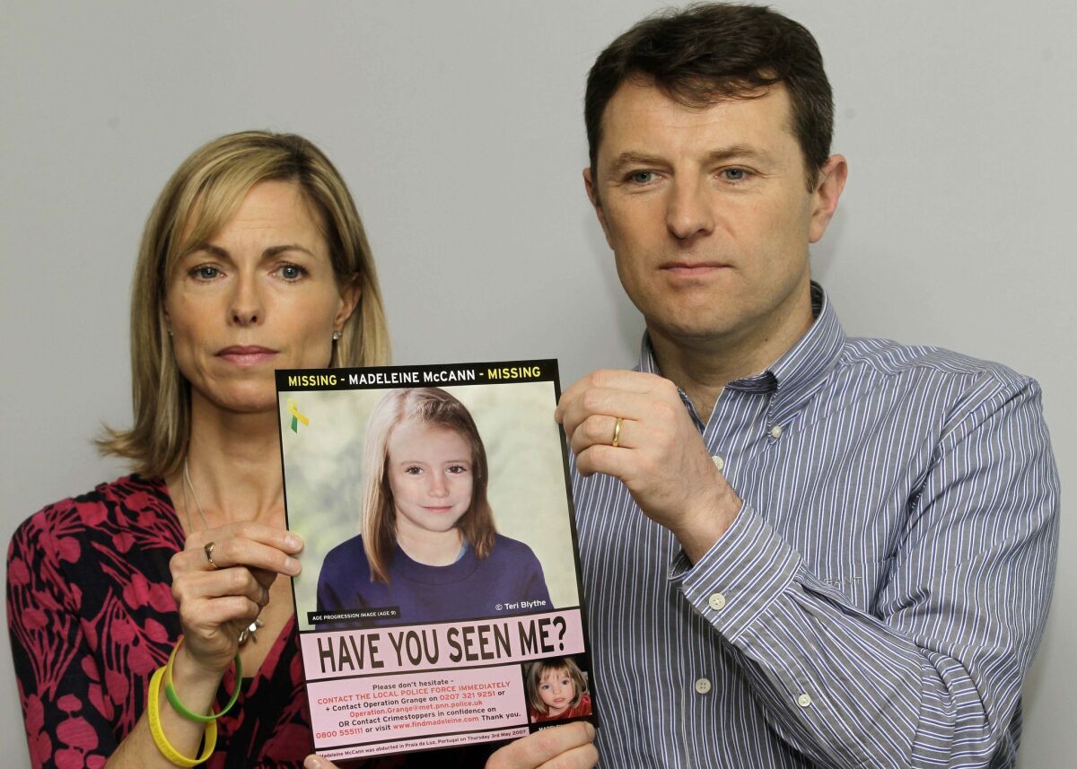 Kate and Gerry McCann's daughter Madeleine disappeared from a vacation rental apartment in Portugal's Algarve region in 2007. Above, they are shown last year holding a computer-generated image of how Madeleine would likely look at age 9.