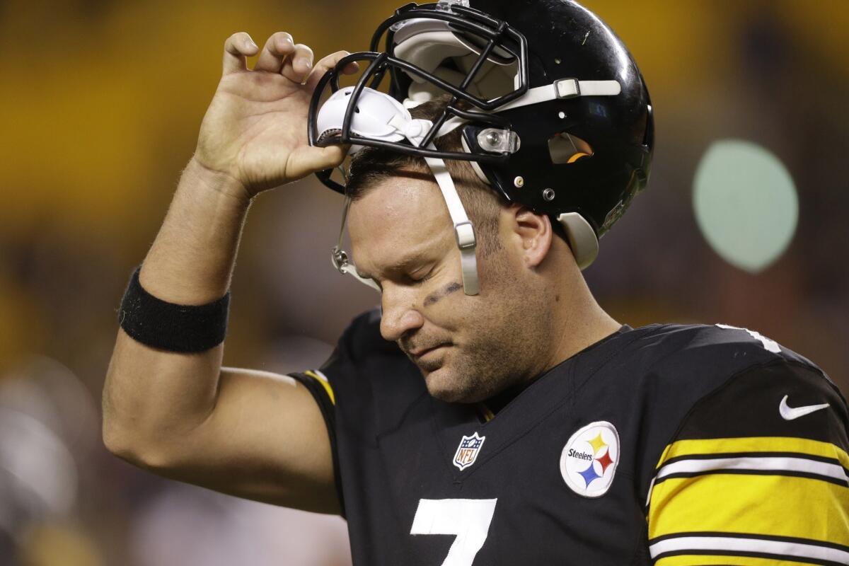 Pittsburgh Steelers quarterback Ben Roethlisberger tugs on his helmet as he leaves the field during the final minutes of the Steelers' loss to the Chicago Bears on Sunday night.