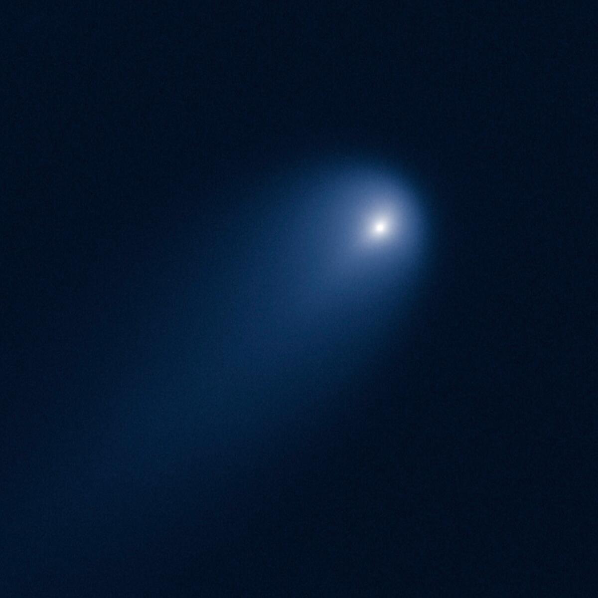 Comet ISON, which experts say may become "the comet of the century" by the time it approaches Earth in late November, is photographed April 10 by the Hubble Space Telescope.