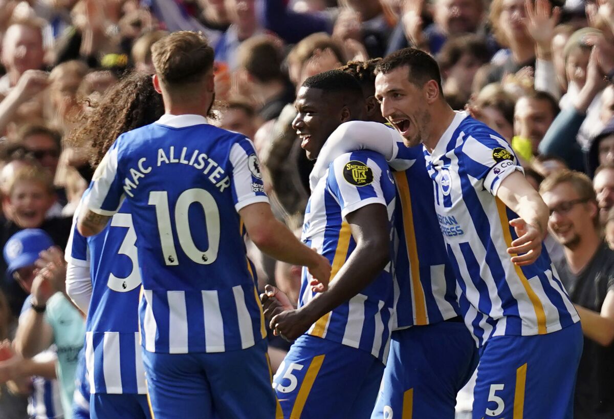 Brighton and Hove Albion's Moises Caicedo, center, celebrates scoring with teammates during the English Premier League soccer match at the AMEX Stadium, Brighton, England, Saturday May 7, 2022. (Gareth Fuller/PA via AP)