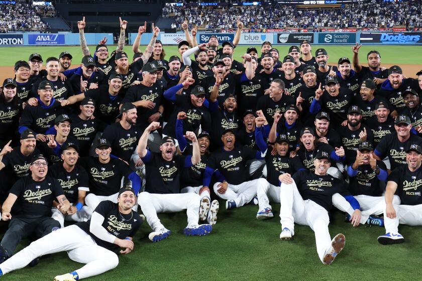 LOS ANGELES, CALIFORNIA - OCTOBER 11: The Los Angeles Dodgers sit for a team photo.