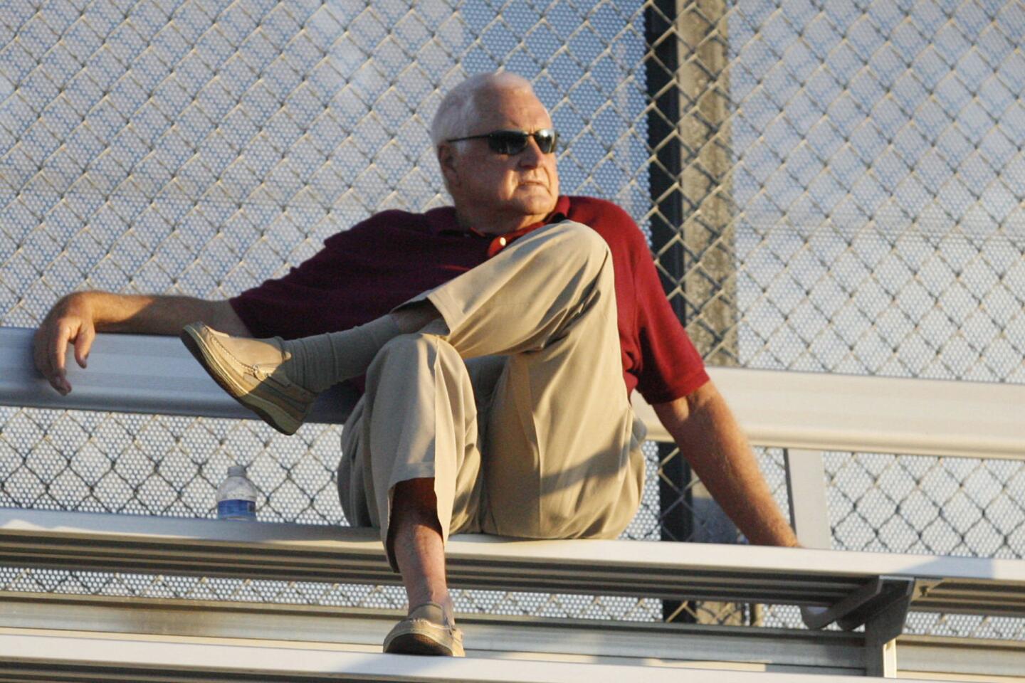 A man sits on the bleachers before a football game between Burroughs and North Hollywood at John Burroughs High School in Burbank on Friday, September 7, 2012.