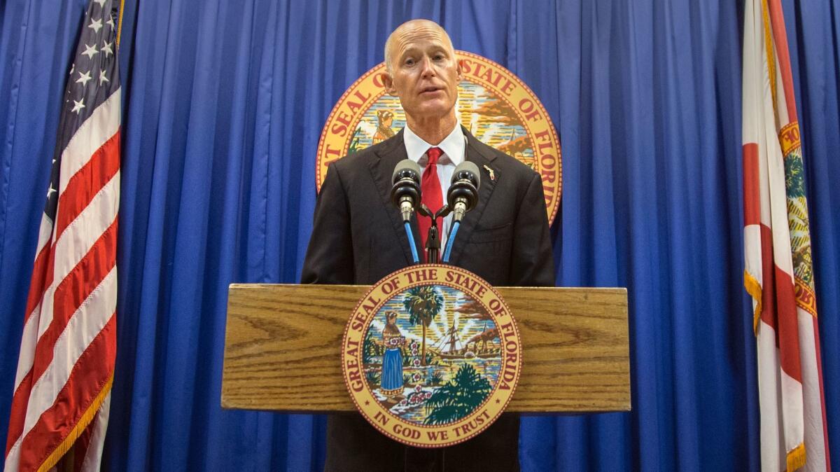 During a news conference in Tallahassee, Fla., on Feb. 23, Gov. Rick Scott proposed banning the sale of firearms to anyone younger than 21.