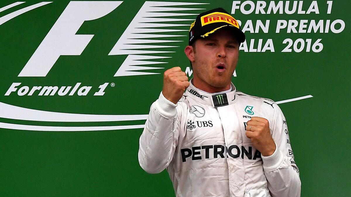 Formula One driver Nico Rosberg celebrates on the podium after winning the Italian Grand Prix on Sunday.