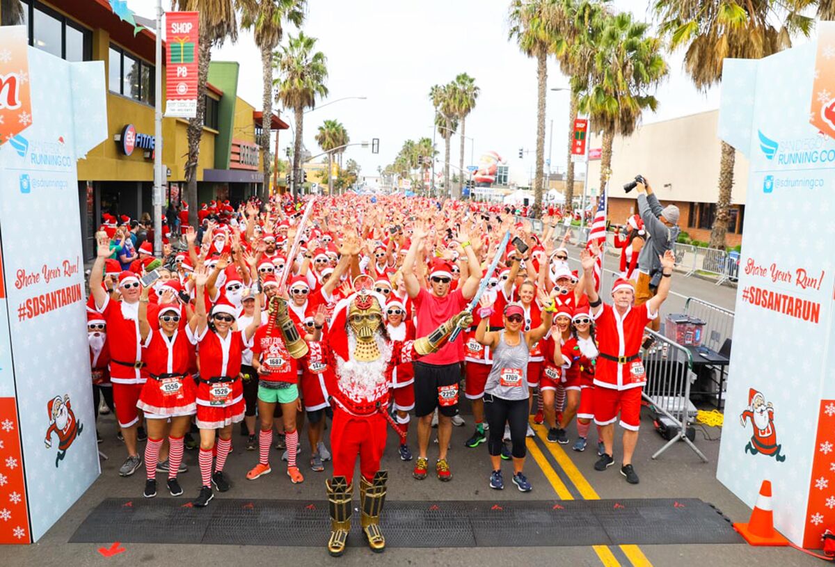 Santa Run 5K participants don “sunny” Santa attire for the race, an outfit included with the entry fee.