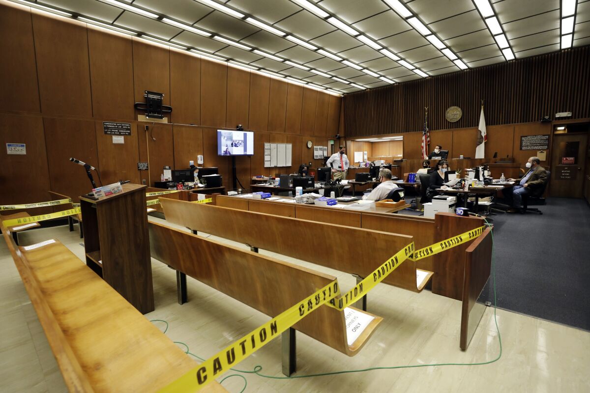 Video arguments take place during a courtroom hearing at the Clara Shortridge Foltz Criminal Justice Center in Los Angeles.