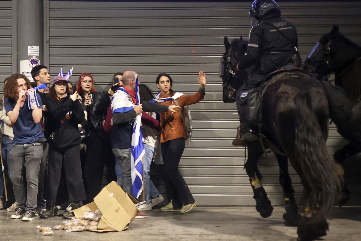 Horse-mounted police disperse protesters 