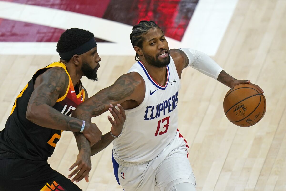 Utah Jazz forward Royce O'Neale pressures Clippers guard Paul George during Game 1.