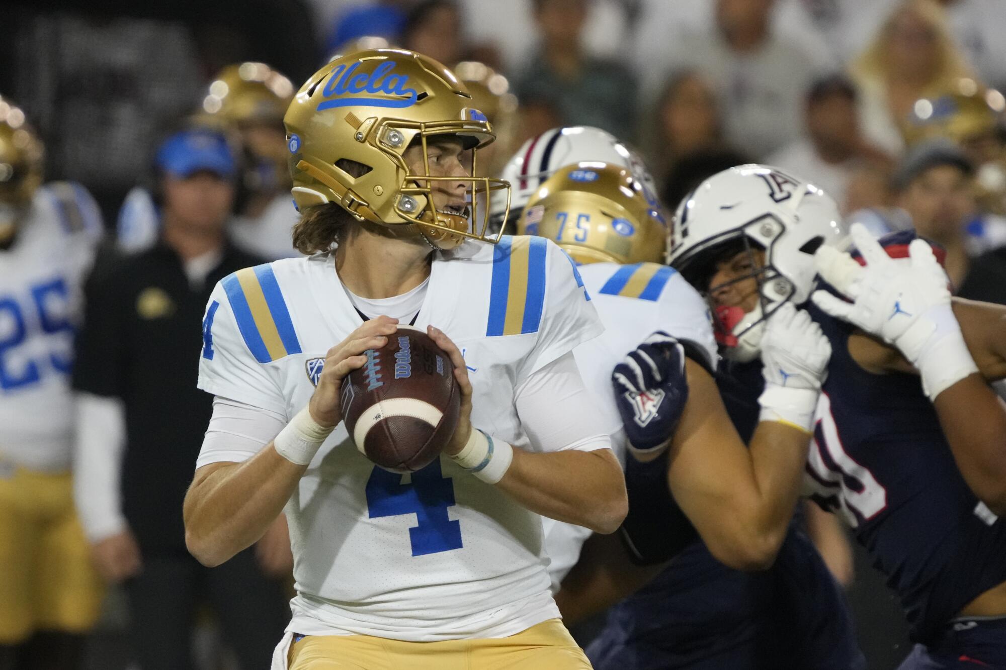 UCLA quarterback Ethan Garbers looks for a receiver during the first half.