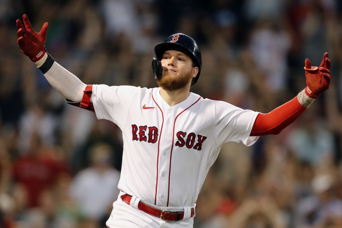 Boston Red Sox's Alex Verdugo celebrates his walk-off, RBI single during the ninth inning of a baseball game against the Cleveland Indians, Saturday, Sept. 4, 2021, in Boston. (AP Photo/Michael Dwyer)