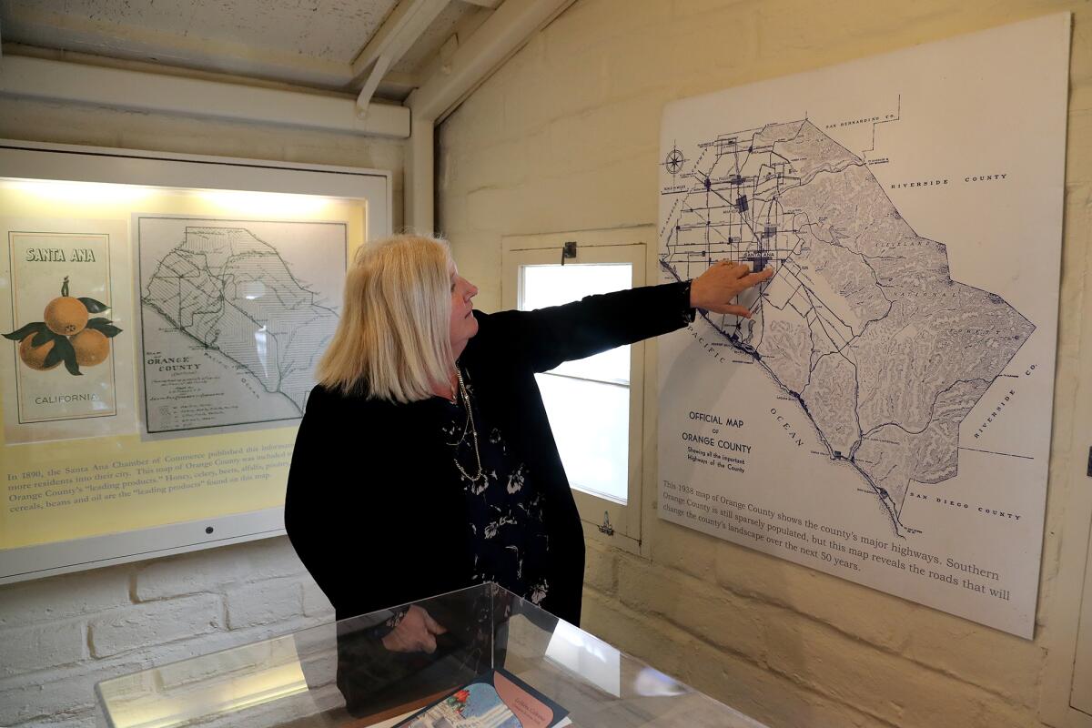 Library director Jill Thrasher talks about an official 1983 map of Orange County.