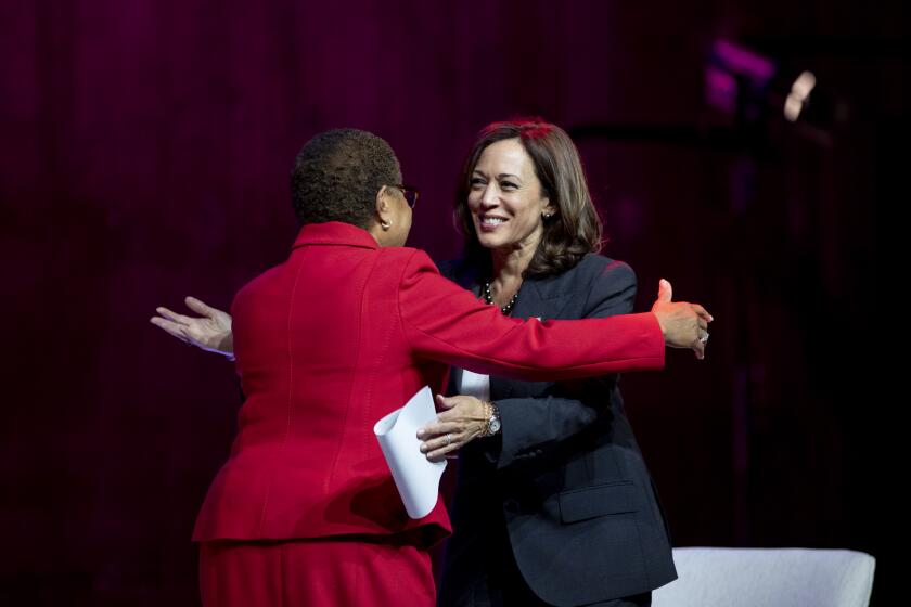 LOS ANGELES, CA - OCTOBER 17, 2022: Vice President Kamala Harris hugs mayoral candidates Karen Bass before a discussion with Bass and Celinda Vazquez, Vice President of Public Affairs for Planned Parenthood of Los Angeles, on protecting reproductive rights at the Nate Holden Performing Arts Center on October 17, 2022 in Los Angeles, California.(Gina Ferazzi / Los Angeles Times)