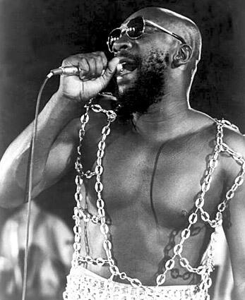 Rough beginnings Isaac Hayes in performance, circa 1970. Born in Covington, Tenn., in 1942, Hayes began singing at an early age, performing at his local church. Hayes lost both his parents when he was an infant, and he was raised by his grandparents. He picked cotton, and taught himself to play the piano.