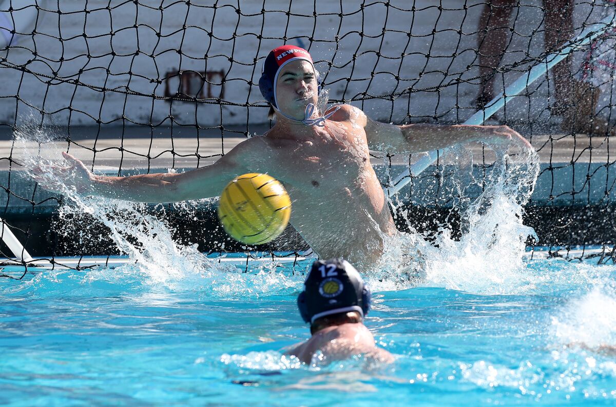 Newport Harbor goalkeeper Cooper Mathisrud stretches on a save attempt against JSerra during the first half Saturday.