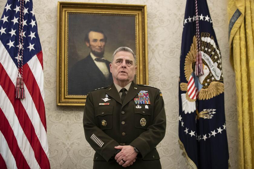 FILE - In this May 15, 2020 file photo, Joint Chiefs Chairman Gen. Mark Milley speaks during the presentation of the Space Force Flag in the Oval Office of the White House with President Donald Trump, in Washington. The top U.S. general held unannounced talks with Taliban peace negotiators in the Persian Gulf to urge a reduction in violence across Afghanistan, even as senior American officials in Kabul warned that stepped-up Taliban attacks endanger the militant group's nascent peace negotiations with the Afghan government. (AP Photo/Alex Brandon, File)