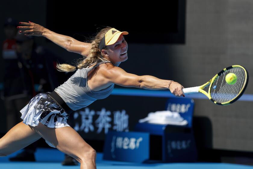 Caroline Wozniacki of Denmark hits a return shot against Katerina Siniakova of the Czech Republic during their third round of the women's singles match in the China Open tennis tournament at the Diamond Court in Beijing, Thursday, Oct. 3, 2019. (AP Photo/Andy Wong)