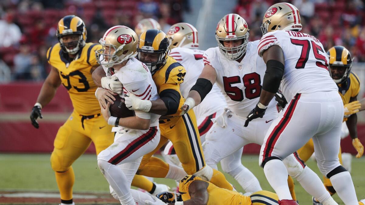 Rams defensive tackle Aaron Donald (99) sacks San Francisco 49ers quarterback C.J. Beathard (3).