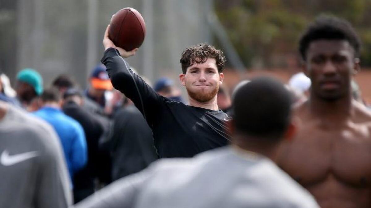 Occidental College quarterback Bryan Scott participates in USC's pro day workout on Wednesday.