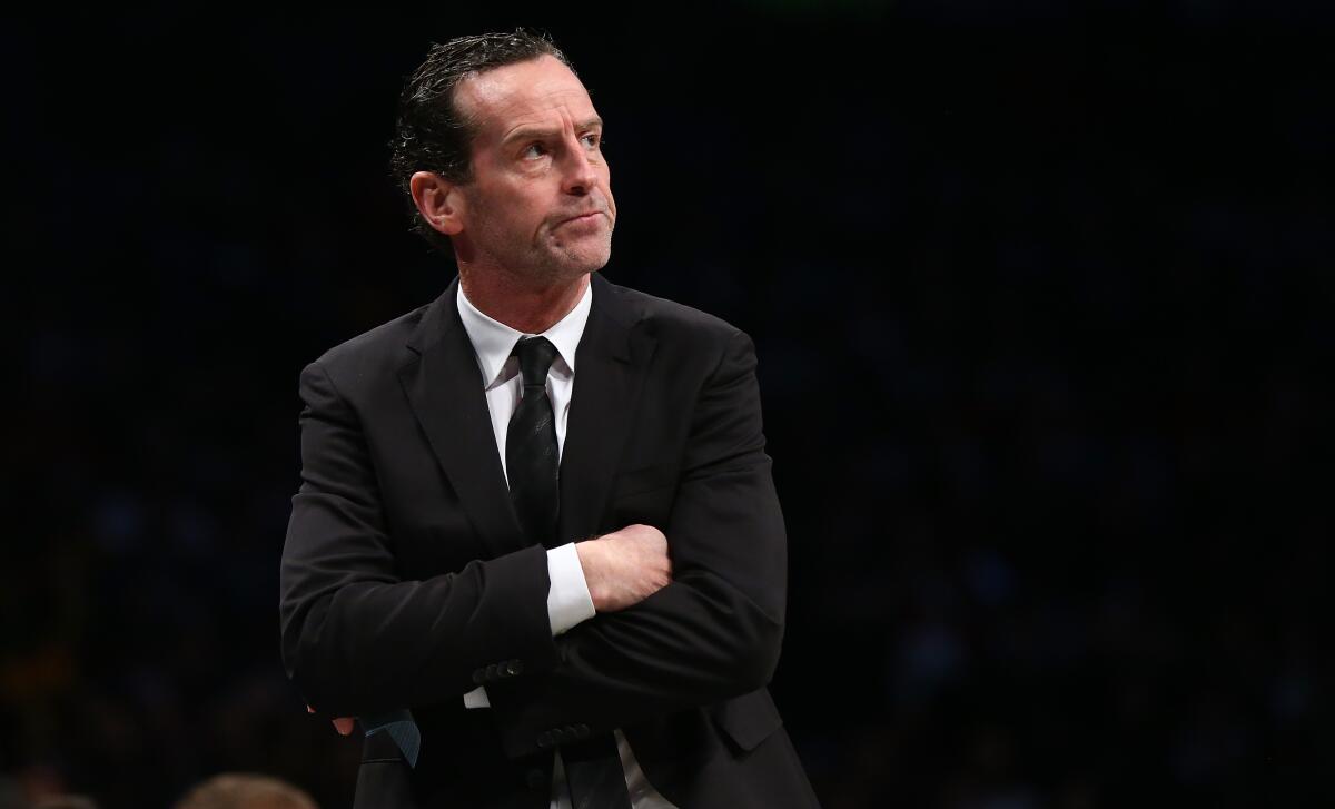Kenny Atkinson looks on from the Brooklyn Nets bench. 
