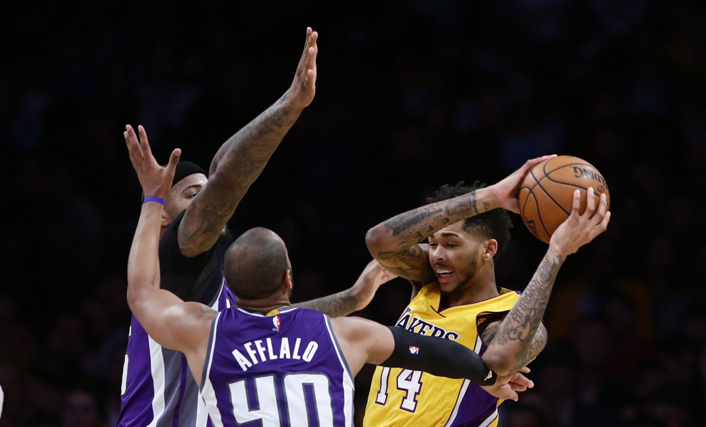 Lakers rookie Brandon Ingram is double-teamed by Kings forward Arron Afflalo (40) and center DeMarcus Cousins during the first half of a game at Staples Center on Feb. 14.