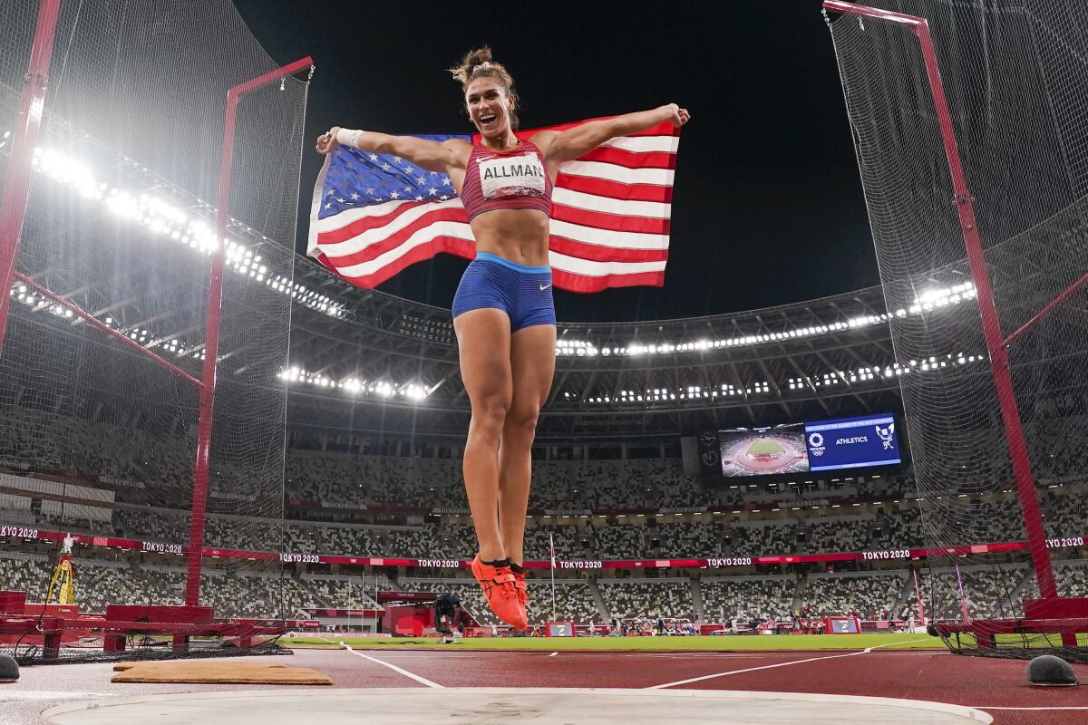 Valarie Allman, of the United States, celebrates after winning the gold medal in the women's discus throw final at the 2020 Summer Olympics, Monday, Aug. 2, 2021, in Tokyo. (AP Photo/David J. Phillip)