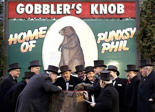 Members of the Punxsutawney Groundhog Club's Inner Circle -- they're the ones in the top hats -- gather around the groundhog known as Punxsutawney Phil at the annual Groundhog Day event in Pennsylvania. The club's members reported that Phil saw his shadow, which according to legend means winter will last for another six weeks.