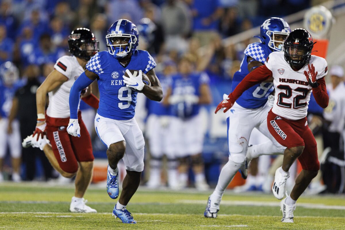 Kentucky wide receiver Tayvion Robinson (9) runs the ball down the field for a touchdown during the second half of an NCAA college football game against Northern Illinois in Lexington, Ky., Saturday, Sept. 24, 2022. (AP Photo/Michael Clubb)