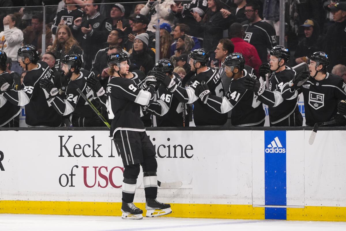 Kings forward Adrian Kempe celebrates with his teammates after scoring against the Canucks.