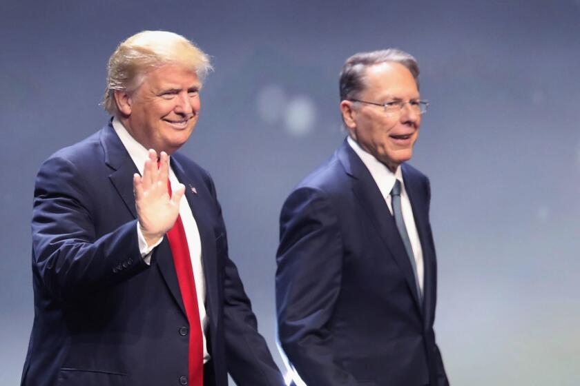 Donald Trump is introduced with Wayne LaPierre, Executive Vice President of the National Rifle Association, at the NRA's annual convention in Louisville, Kentucky on May 20.