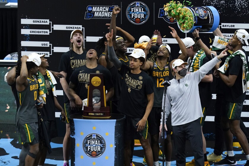 Baylor players and coaches celebrate after the NCAA tournament championship game against Gonzaga.