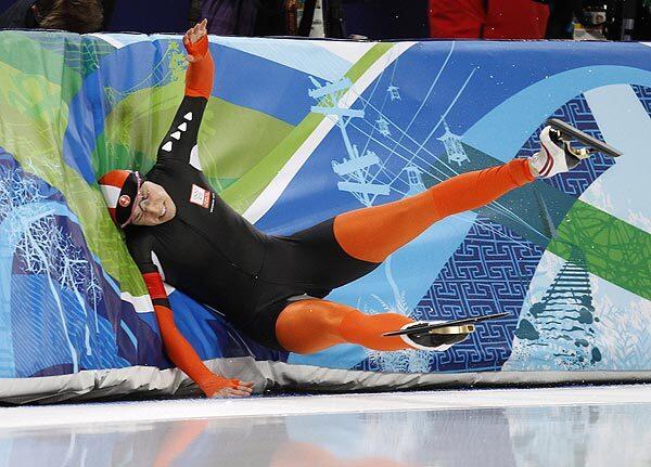 Annette Gerritsen crashes during her first heat in the women's 500-meter race Tuesday at Richmond Olympic Oval. Korea's Lee Sang-Hwa won the event.