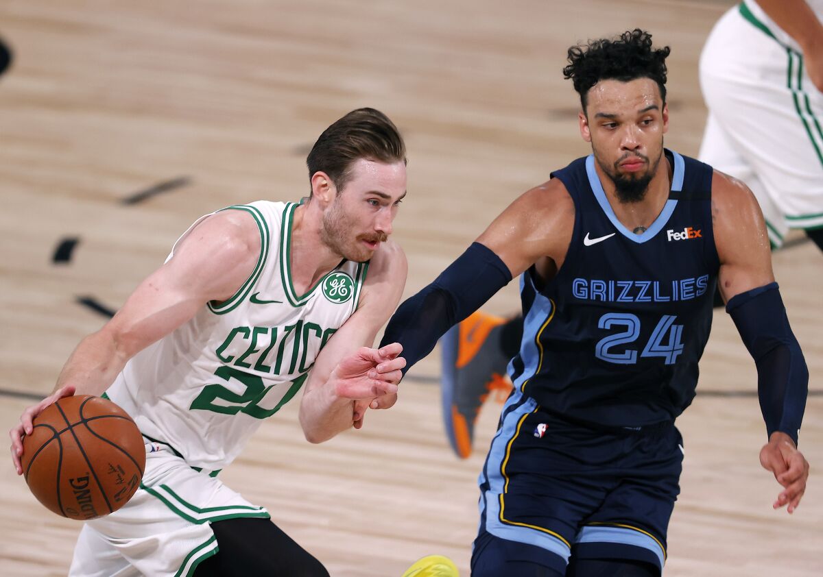 The Boston Celtics' Gordon Hayward drives on the Memphis Grizzlies' Dillon Brooks.