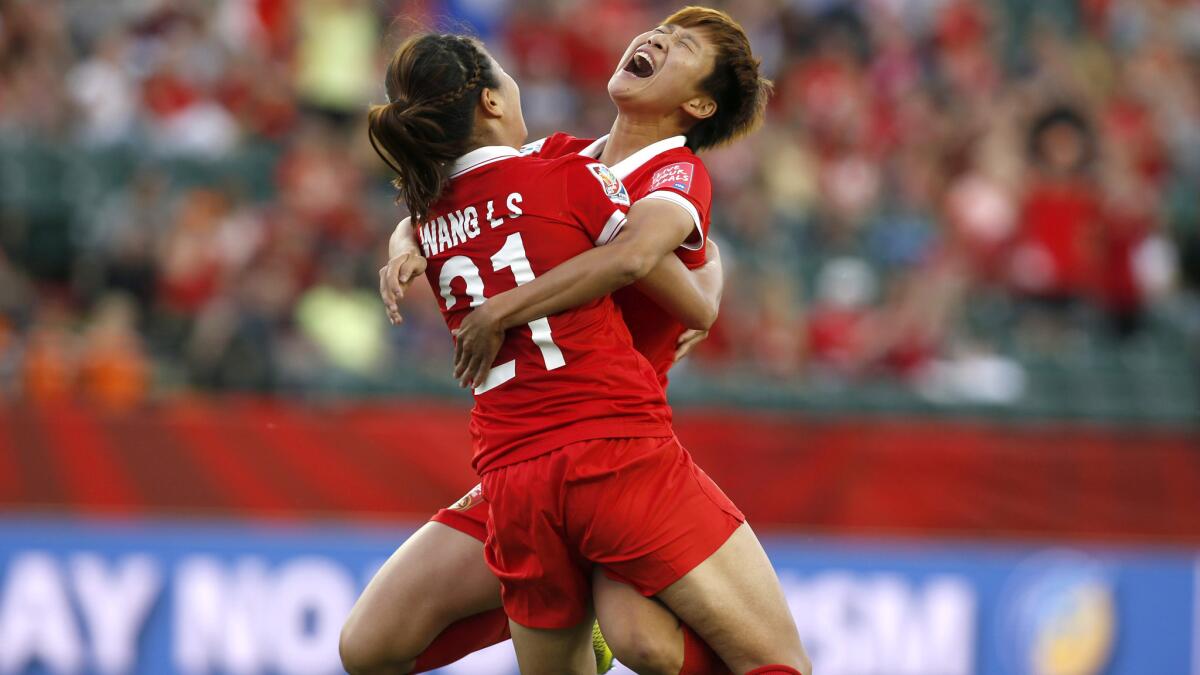 China forward Wang Lisi (21) celebrates her goal against Netherlands with teammate Lou Jiahui in the second half of their Women's World Cup group game on Thursday.