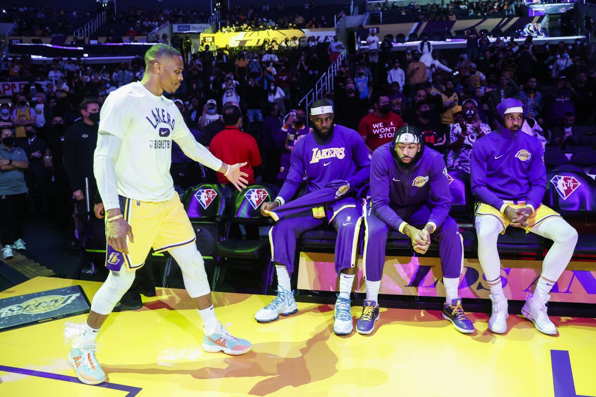Lakers guard Russell Westbrook greets forwards LeBron James, Anthony Davis and Carmelo Anthony.